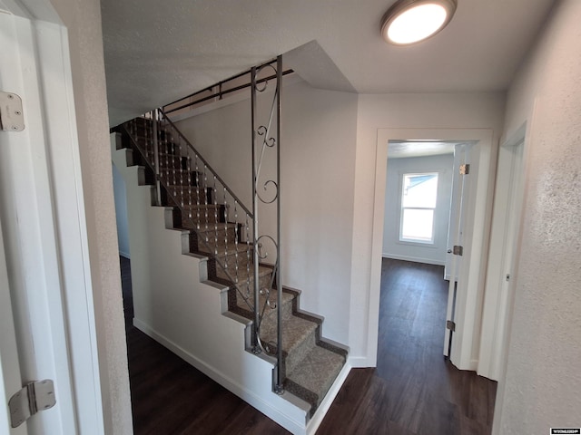 stairs featuring wood-type flooring