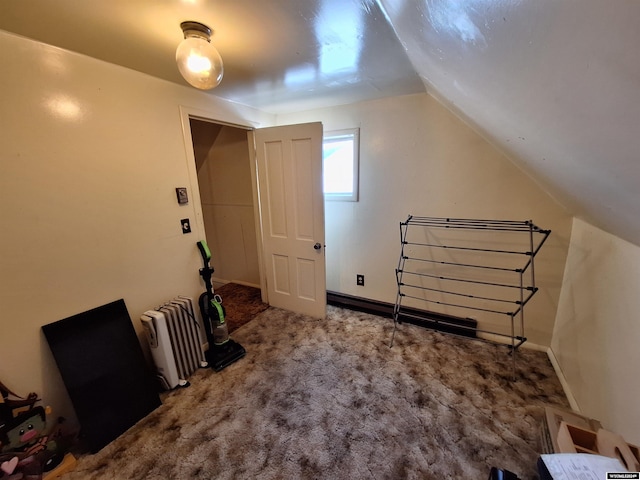 bonus room featuring vaulted ceiling and carpet