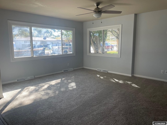 empty room featuring carpet and ceiling fan