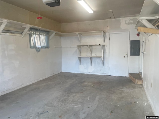 garage featuring a garage door opener and electric panel