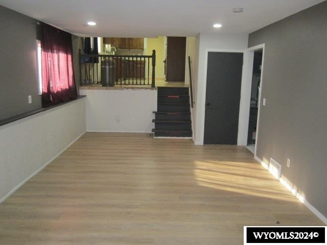 interior space with hardwood / wood-style flooring