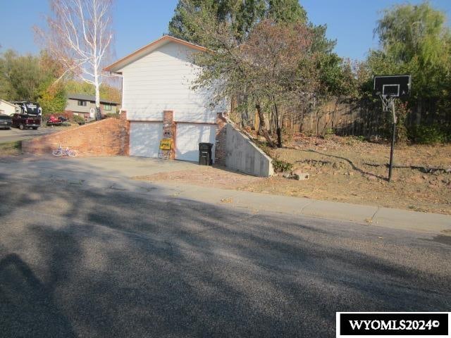 view of property exterior with a garage