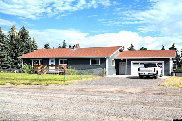 single story home with a front lawn and a garage