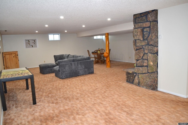 carpeted living room with a textured ceiling