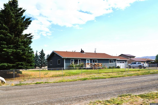 ranch-style house featuring a garage