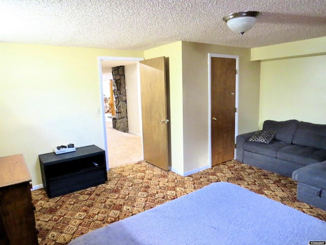 carpeted bedroom with a textured ceiling