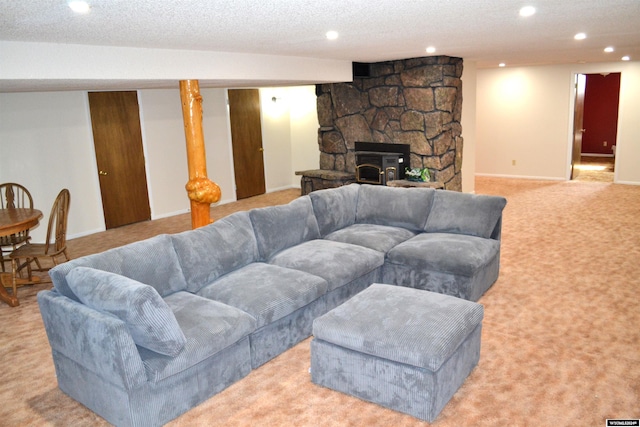 living room featuring a textured ceiling and light carpet