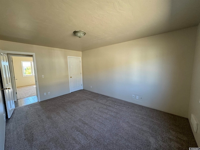 empty room featuring carpet flooring