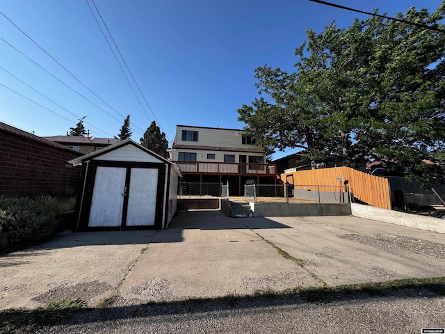 view of front of house featuring a storage unit