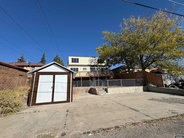 back of property with a shed