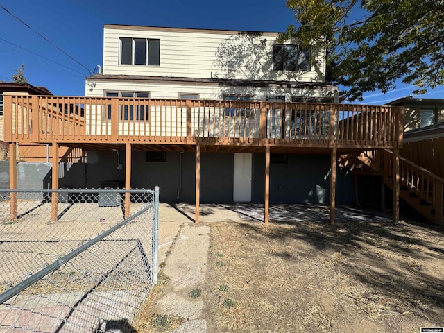 back of property featuring a deck