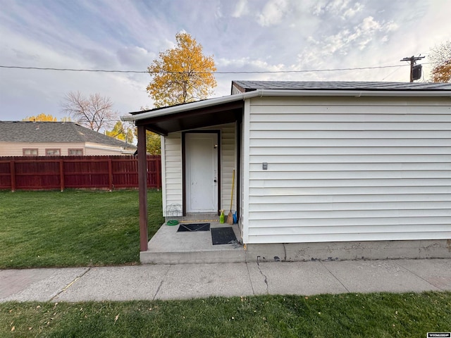 view of outbuilding featuring a yard