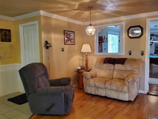 living room with crown molding and hardwood / wood-style flooring