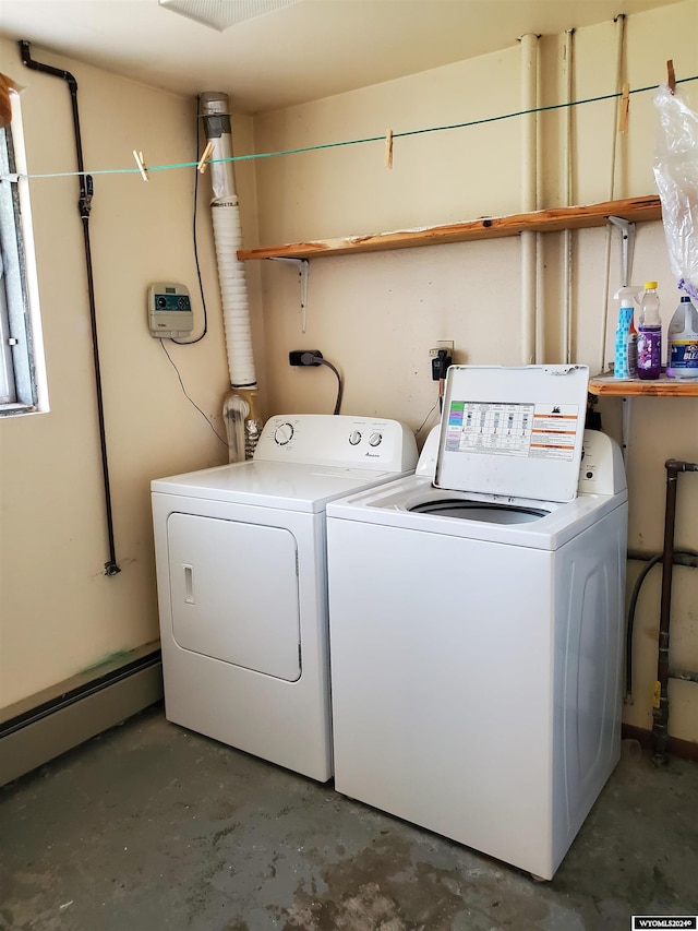 washroom with washer and clothes dryer and baseboard heating