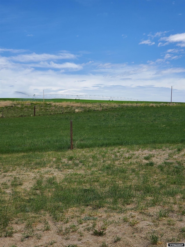 view of yard with a rural view