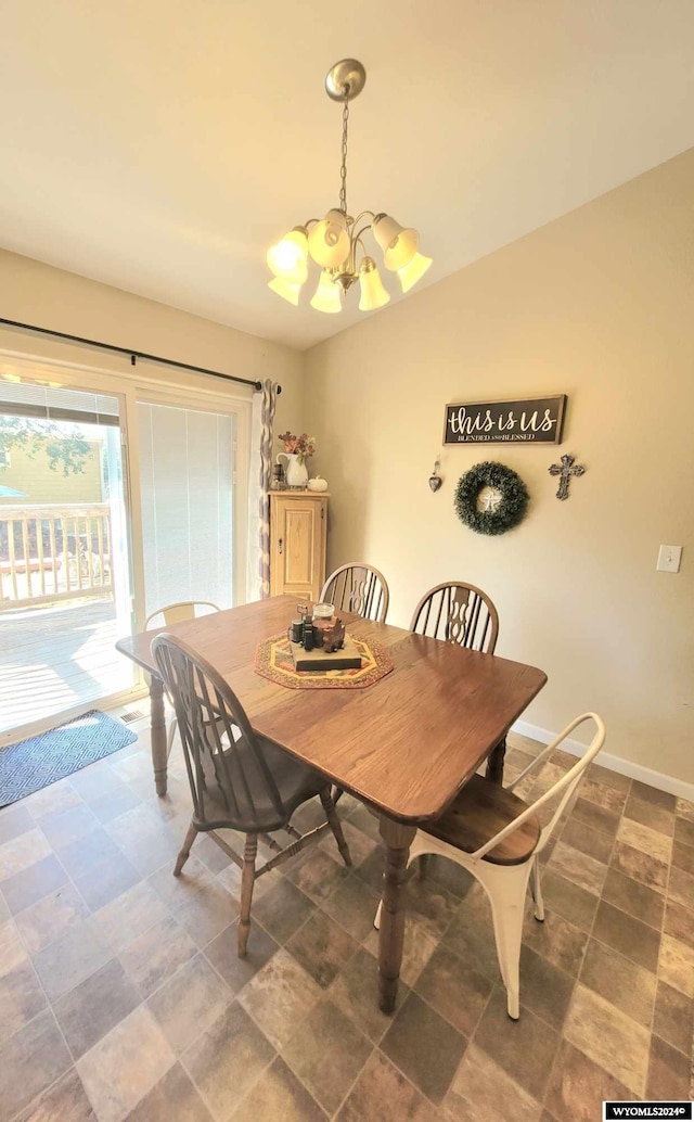 dining area with a notable chandelier