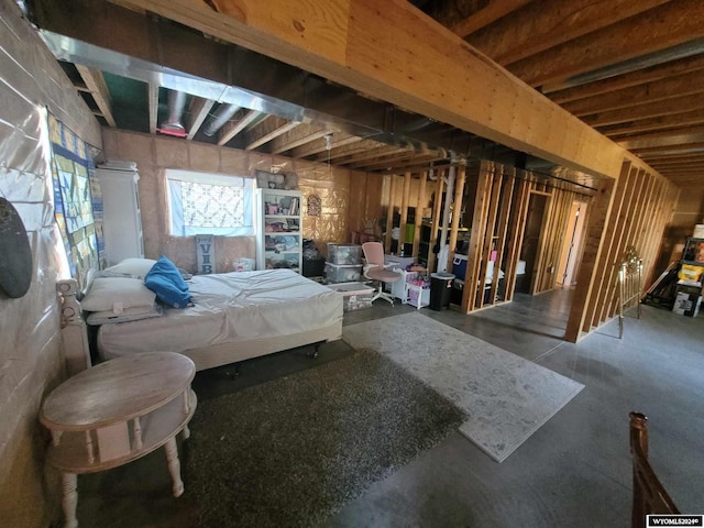 bedroom featuring concrete floors