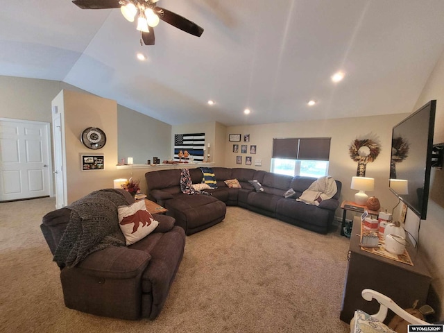 carpeted living room featuring ceiling fan and lofted ceiling