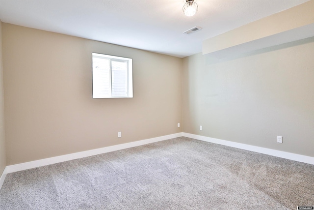 unfurnished room featuring carpet