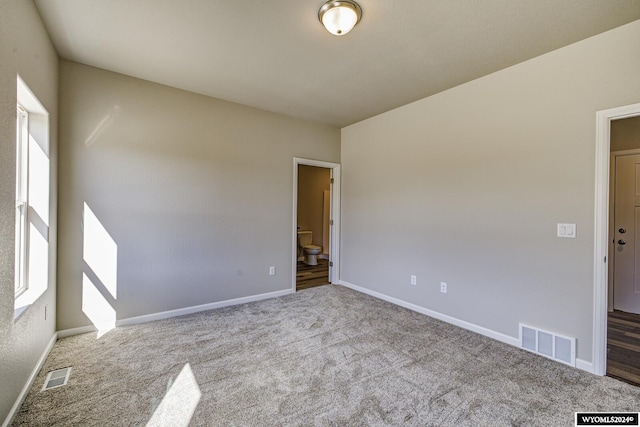 empty room featuring light carpet