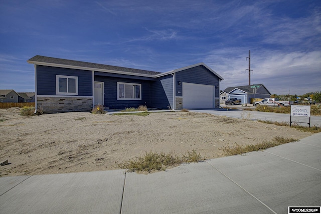 single story home featuring a garage