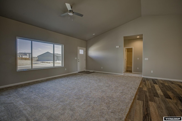 spare room featuring hardwood / wood-style flooring, ceiling fan, and lofted ceiling