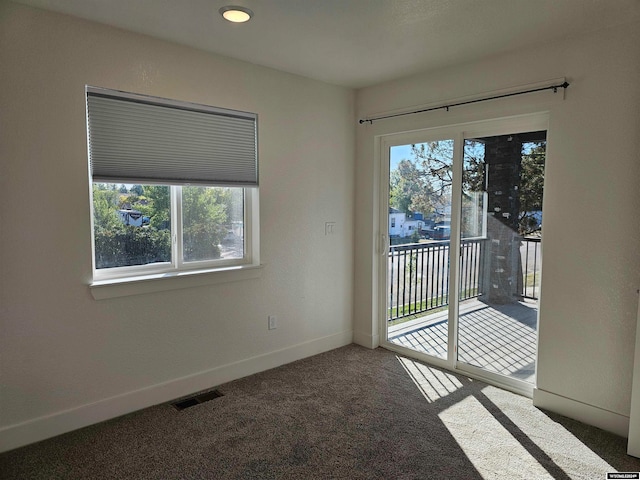 spare room featuring carpet flooring