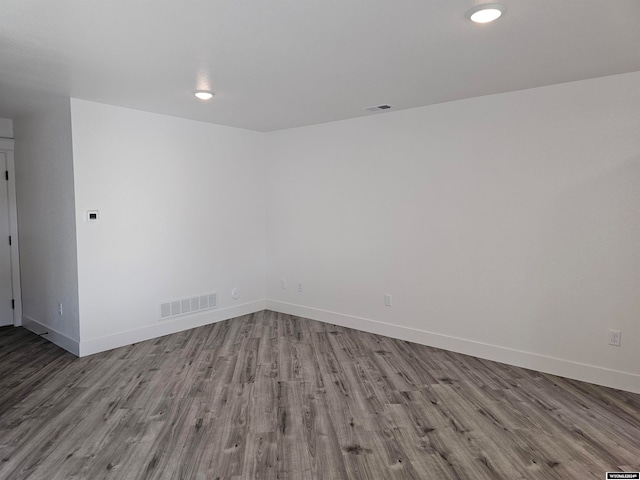 unfurnished room with light hardwood / wood-style floors