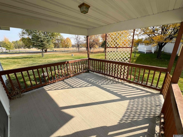 deck featuring a lawn