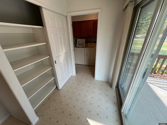 closet with washing machine and dryer