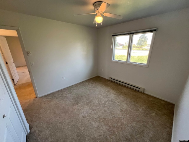 empty room featuring ceiling fan, a baseboard heating unit, and light carpet