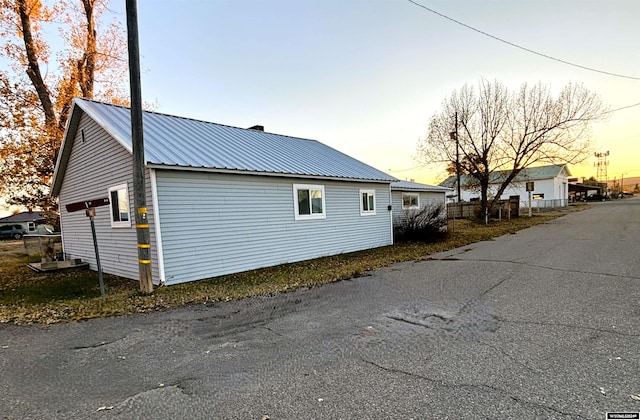 view of property exterior at dusk