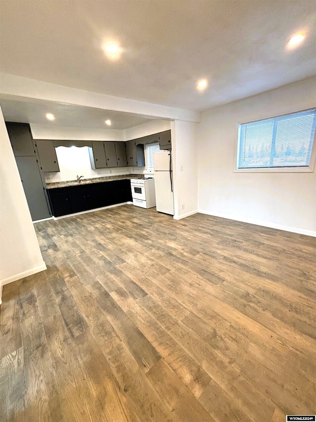 unfurnished living room featuring hardwood / wood-style floors