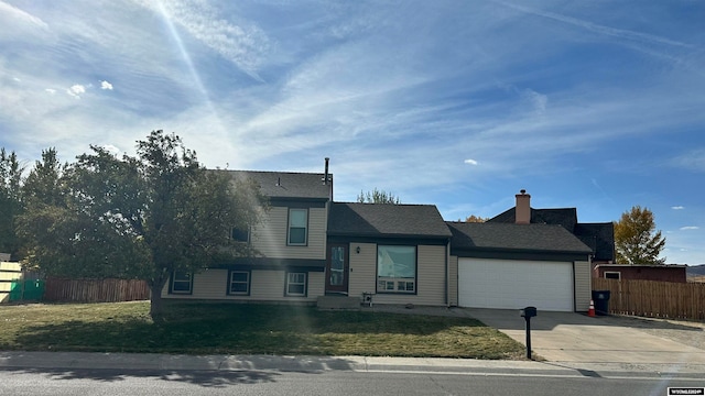 view of front facade featuring a garage and a front lawn