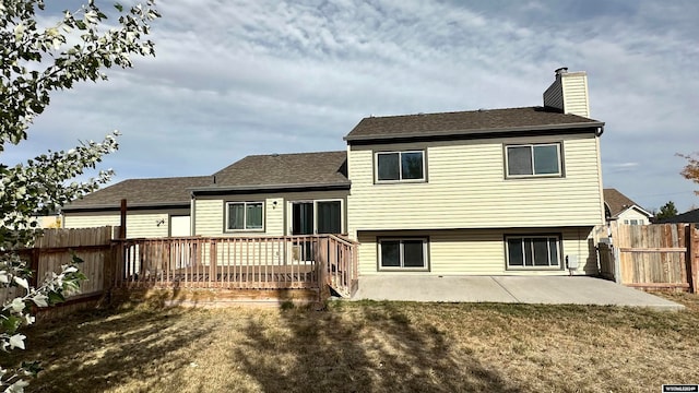 rear view of property with a patio and a deck