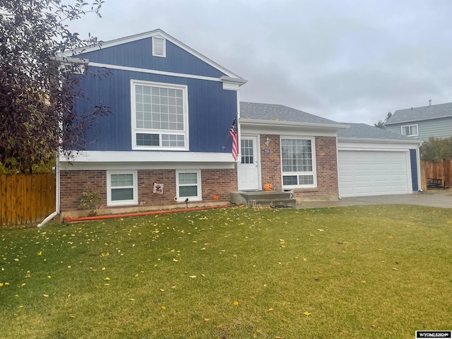 view of front facade with a front lawn and a garage