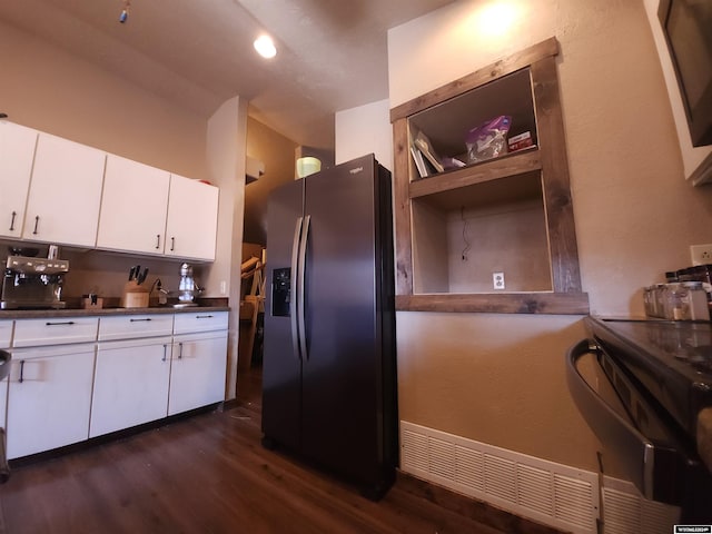 kitchen with white cabinetry, dark hardwood / wood-style floors, electric range, and stainless steel fridge with ice dispenser