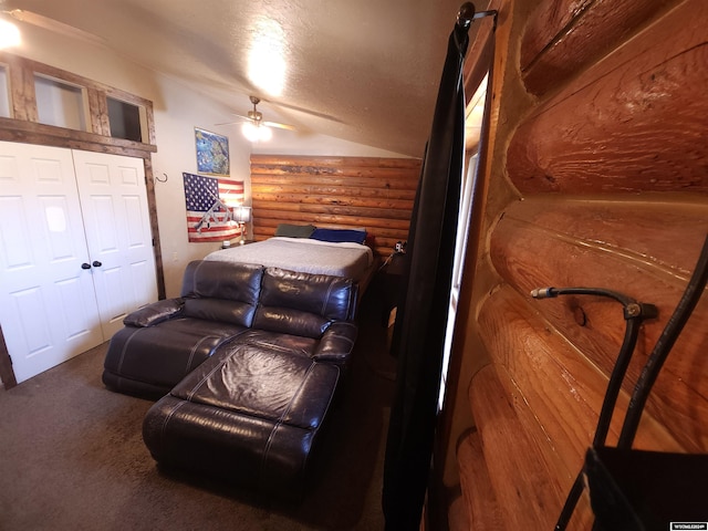 carpeted bedroom featuring a textured ceiling and ceiling fan