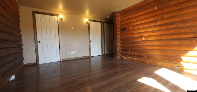 unfurnished room featuring dark hardwood / wood-style floors