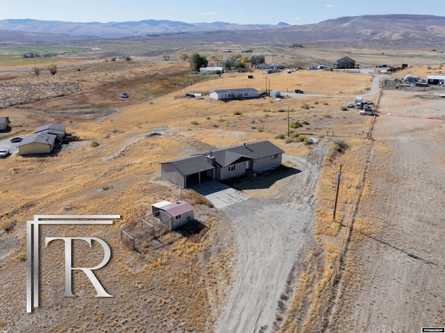 birds eye view of property featuring a rural view and a mountain view