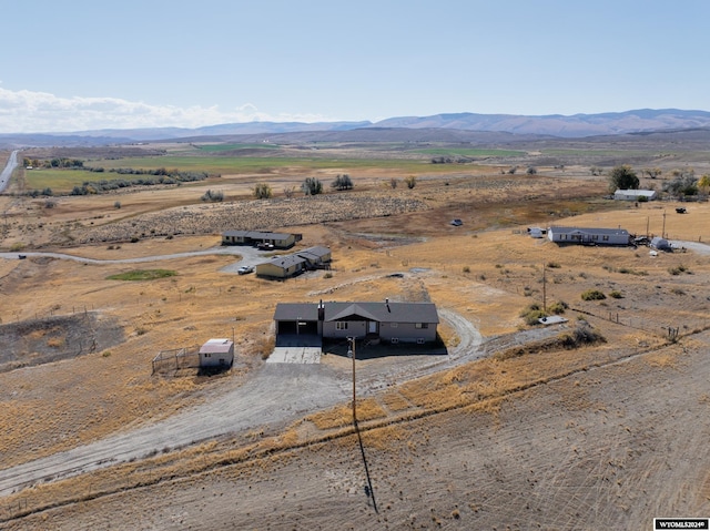 birds eye view of property with a rural view and a mountain view