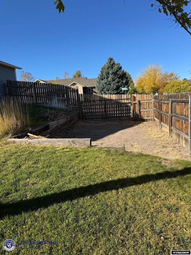 view of yard with a fenced backyard