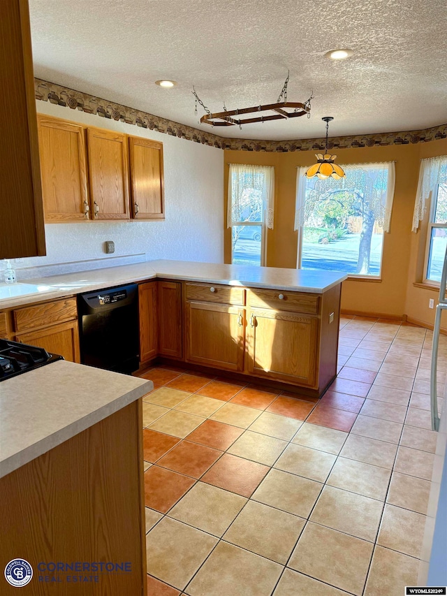 kitchen featuring black dishwasher, light tile patterned floors, light countertops, a textured ceiling, and a peninsula