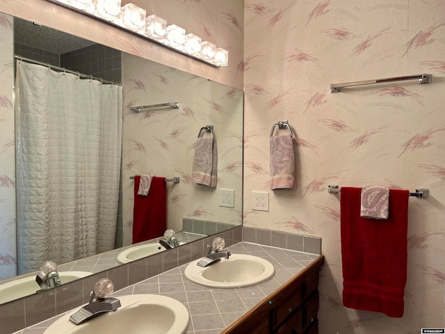 bathroom with vanity and walk in shower