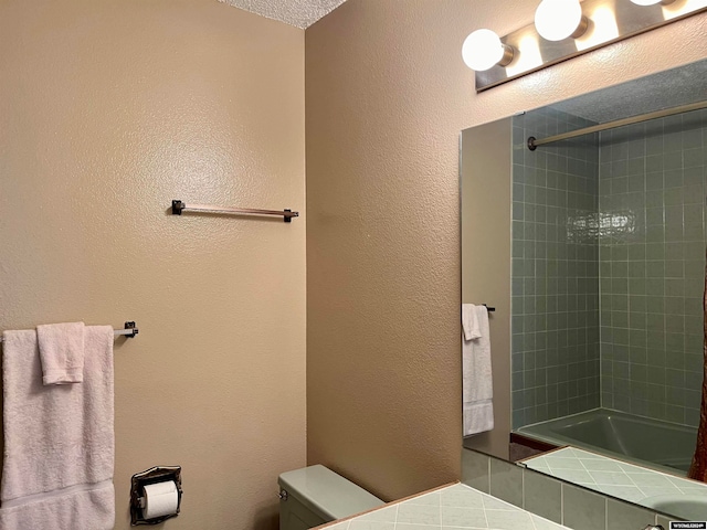 bathroom with toilet and tiled shower / bath combo