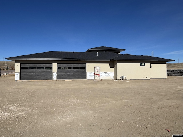 6060 Rivers Gate, Casper, WY 82604 - view of front of property featuring stucco siding and a detached garage