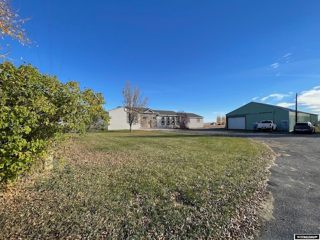 view of yard featuring a garage