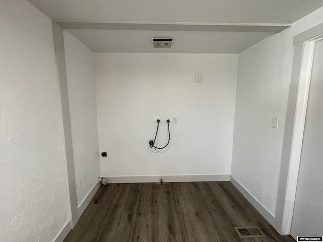 washroom featuring hookup for an electric dryer and dark hardwood / wood-style floors