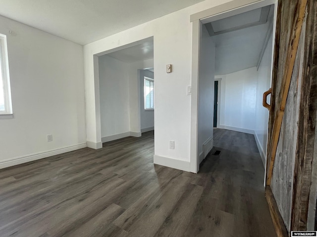 empty room featuring dark wood-type flooring