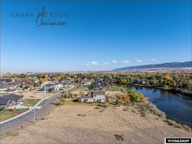 bird's eye view with a water and mountain view